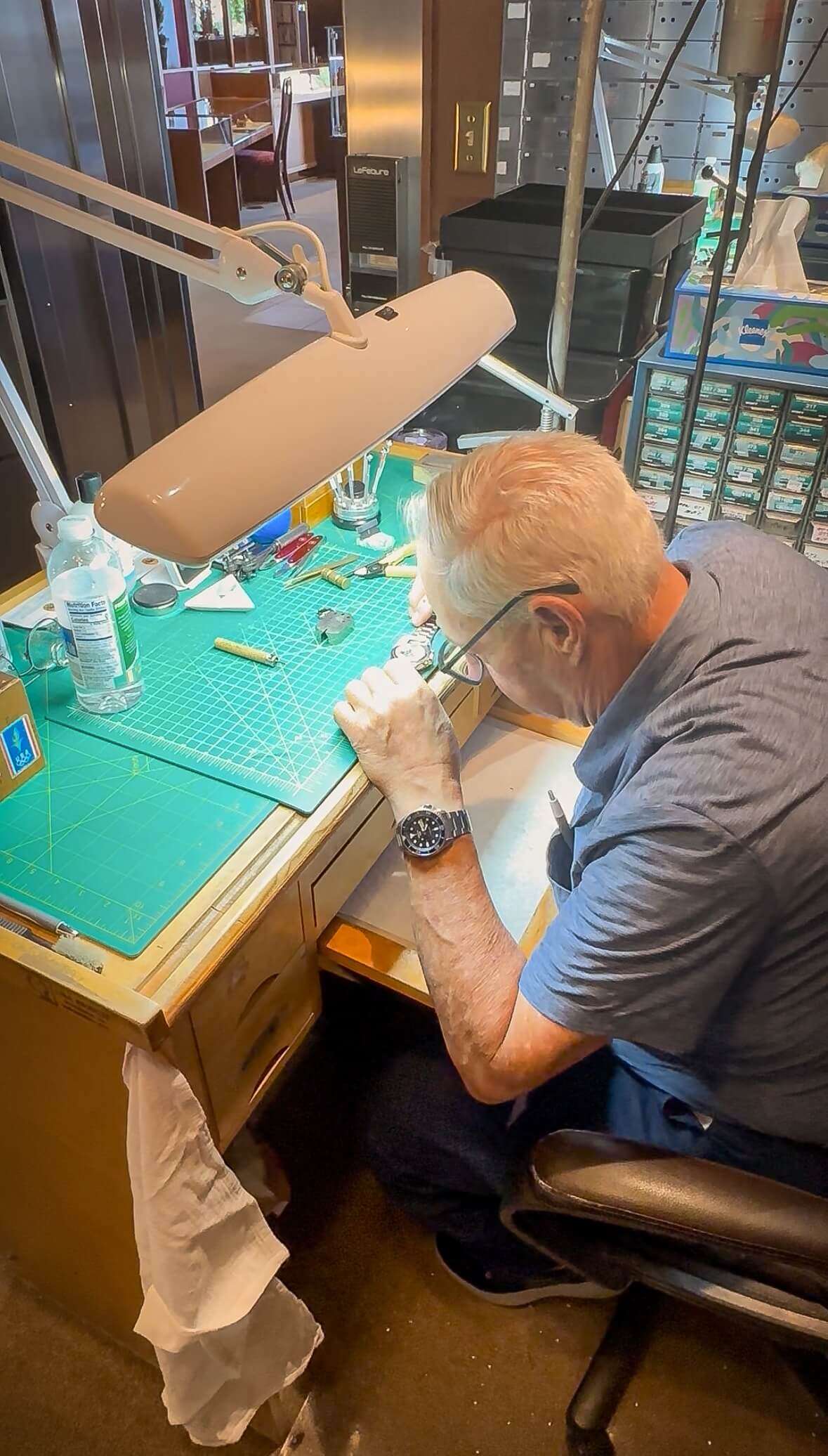 Tom Baggett Certified Master Watchmaker at his workstation at Cranstoun Court Jewellers